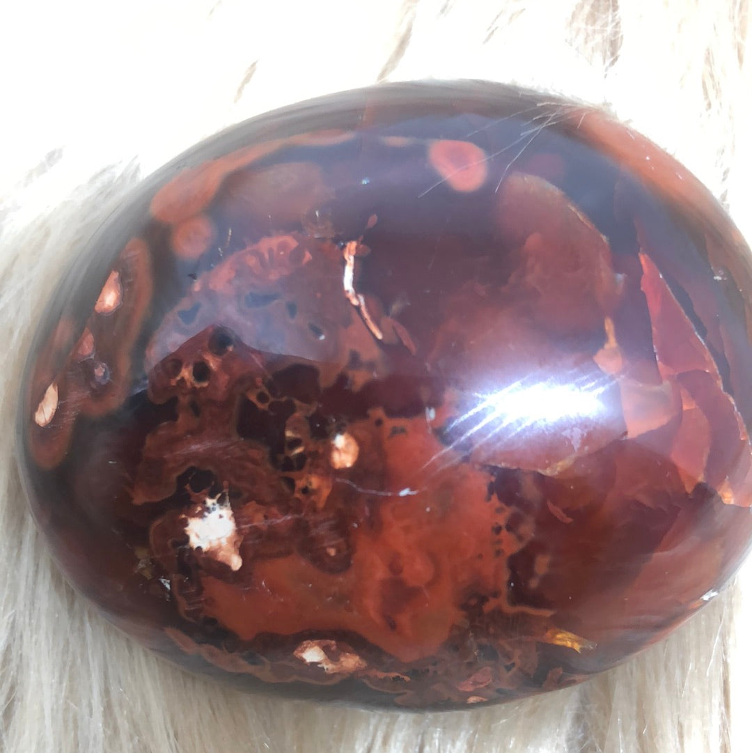 Red carnelian palm stone
