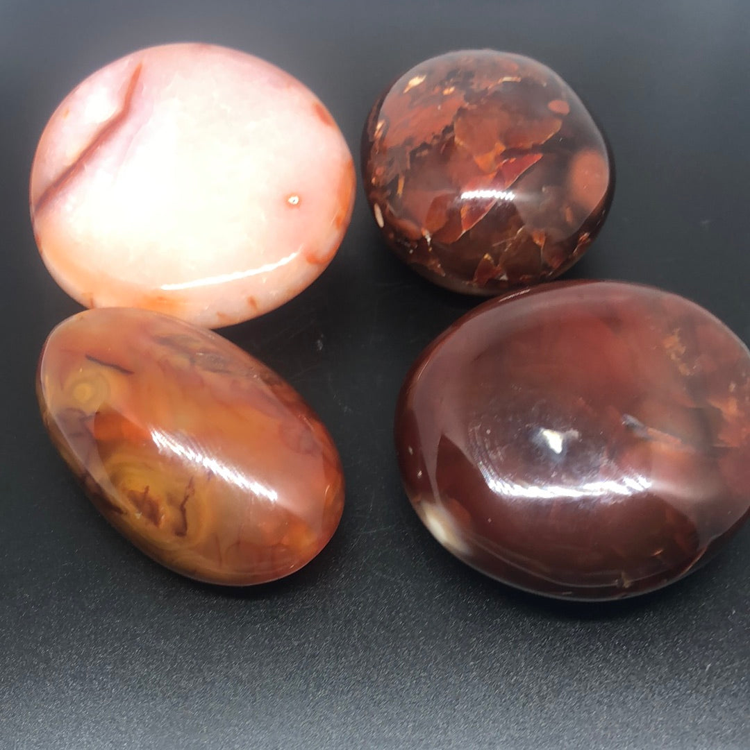 Red carnelian palm stone