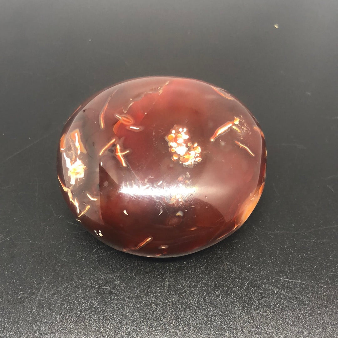 Red carnelian palm stone