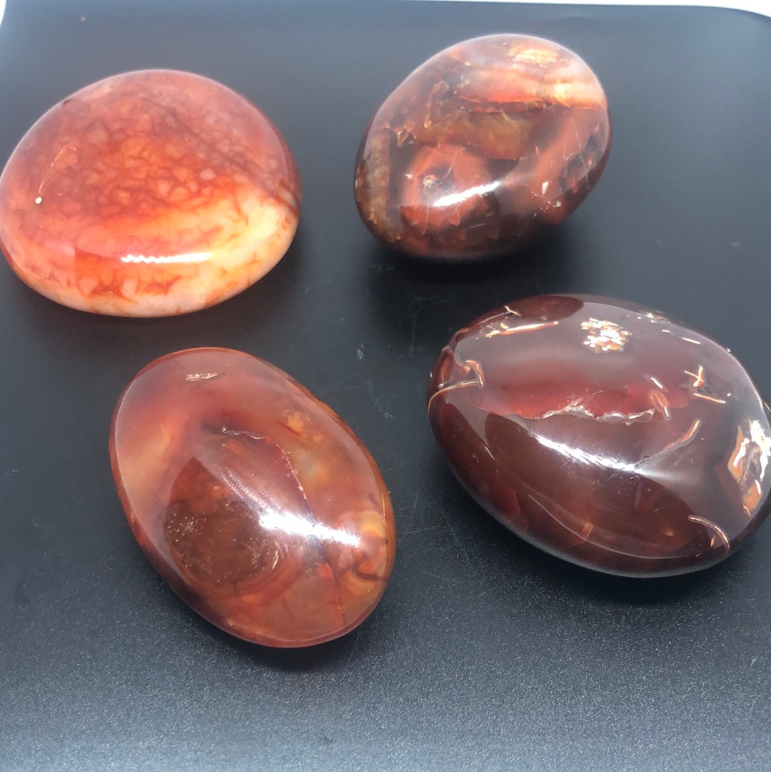 Red carnelian palm stone
