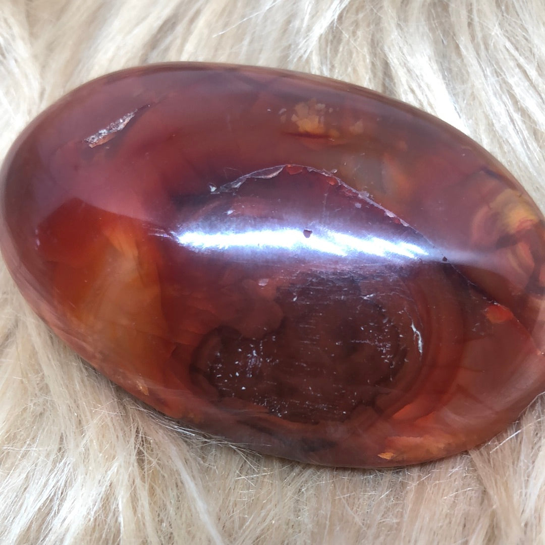 Red carnelian palm stone