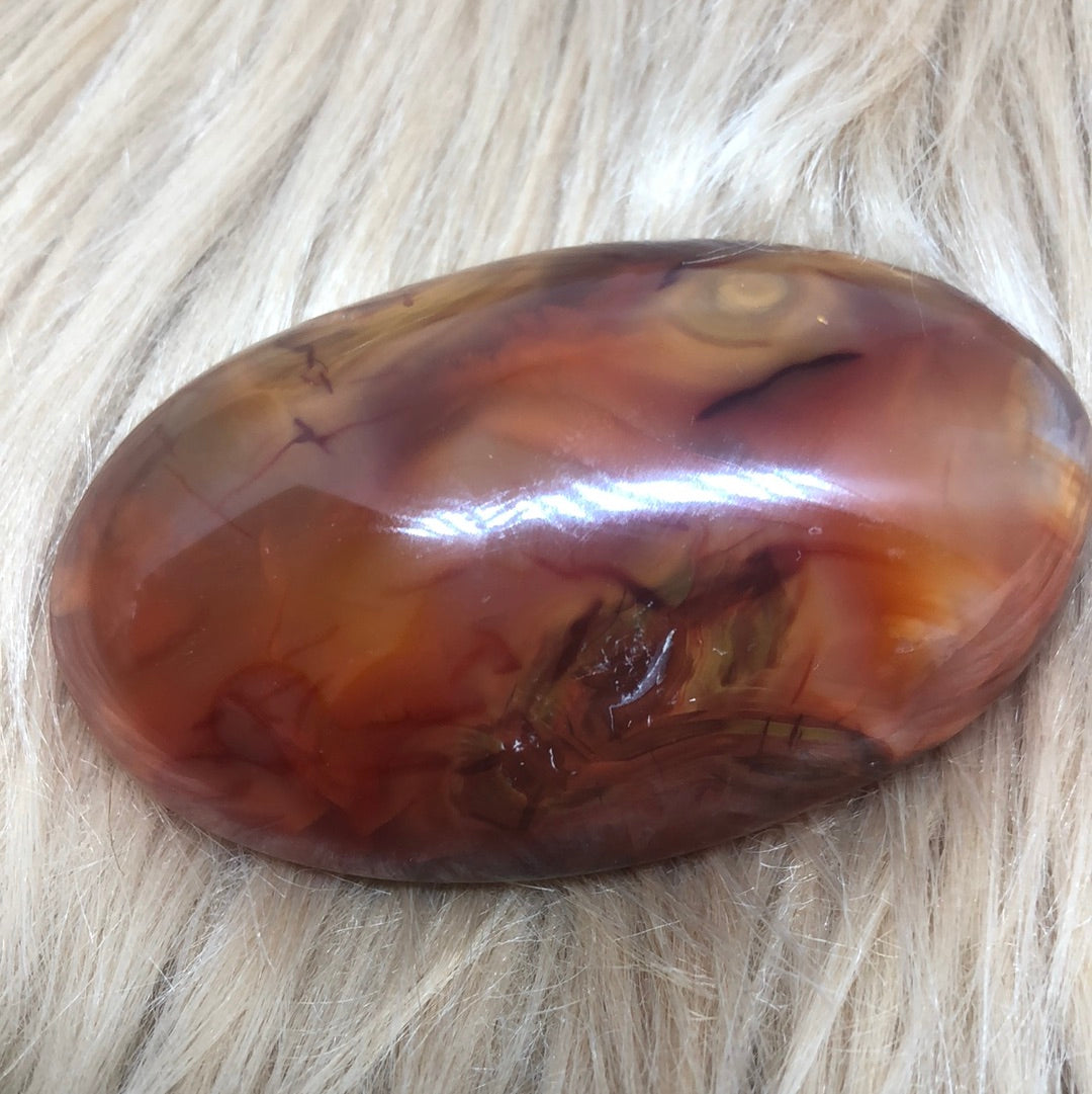 Red carnelian palm stone
