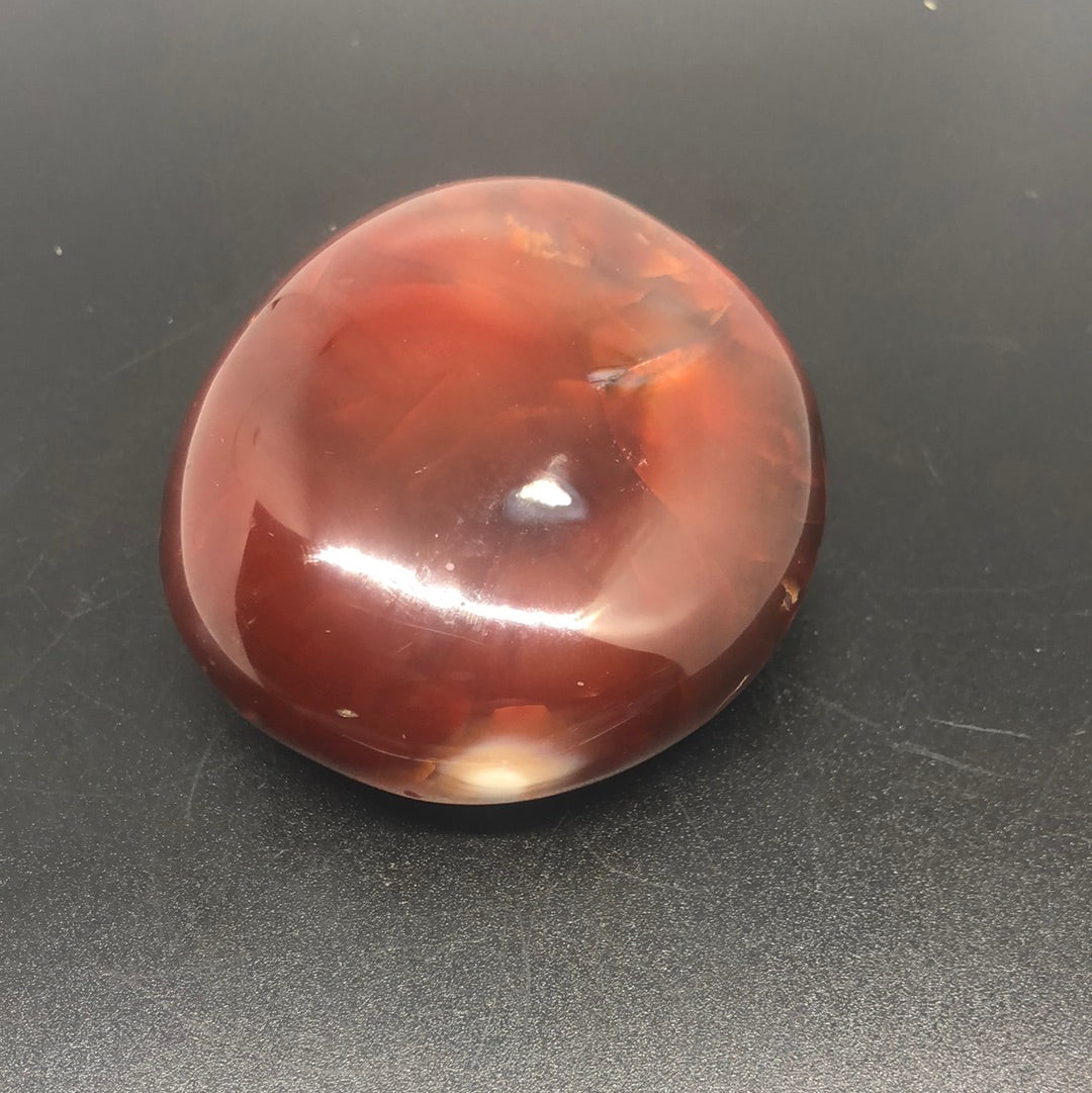 Red carnelian palm stone