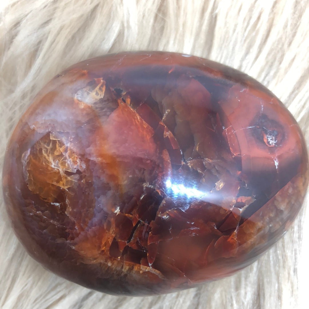 Red carnelian palm stone